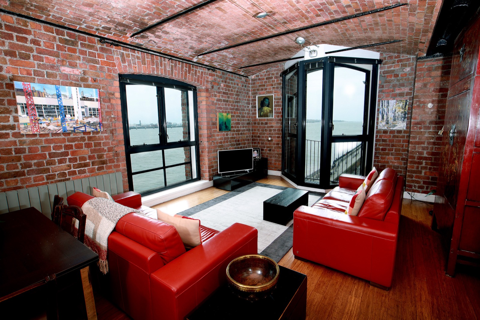 A modern living room with secondary glazed windows by Cara Glass