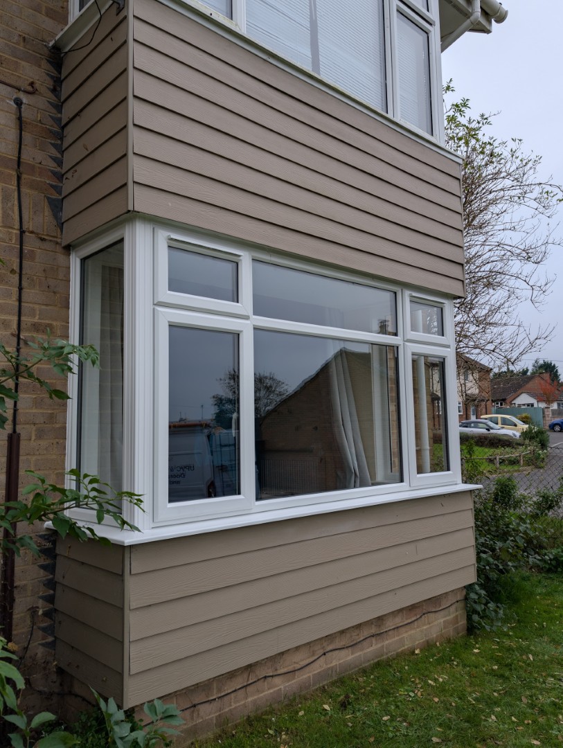 White upvc bay windows with cladding